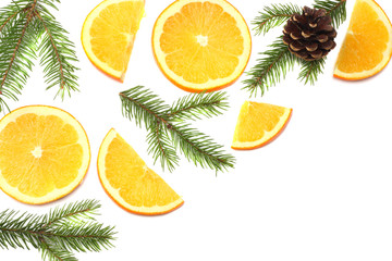 Fototapeta na wymiar Christmas background. orange with slices, cone and fir tree isolated on white background top view