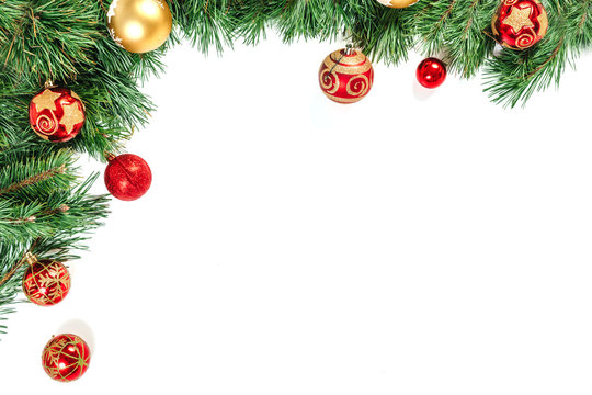 Christmas frame - tree branches with gold and red balls isolated on white background. Isolate.