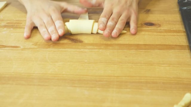 hands of the chef prepare croissants. 4k