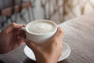 Working Woman drinking hot coffee in the morning.