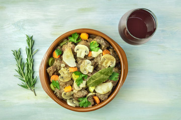 Overhead photo of meat and mushrooms ragout with wine