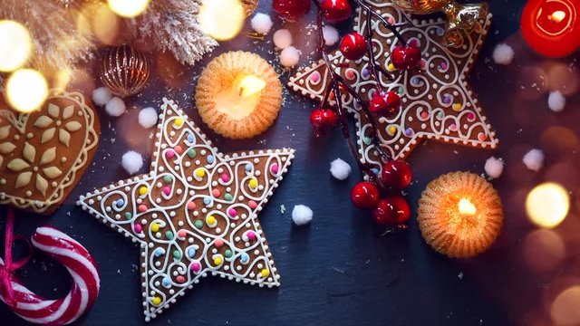 Christmas holiday background with decorations, candles, gingerbread and candy cane. 4K UHD video 3840x2160