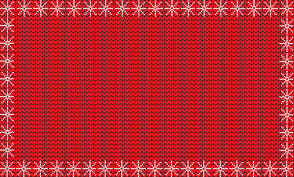 Red festive knitted background framed with white snowflakes.