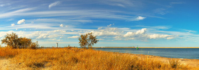Panoramic image of a mouth of Swina river in Swinoujscie, Poland, in Autumn - obrazy, fototapety, plakaty