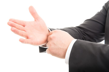 Close-up of business man hands arranging his sleeves