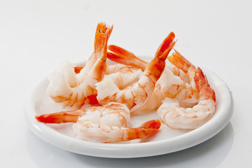 Jumbo Head Less Cooked prawns on white plate on white background