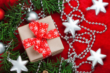 Christmas background with gift on red background. Merry christmas card. Winter holiday theme. Happy New Year. Space for text.