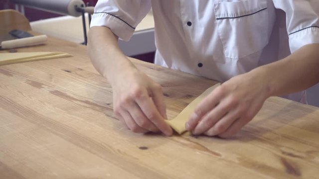 hands of the chef prepare croissants. 4k