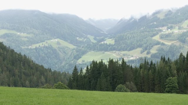 The mountain range of the Austrian Alps, on which the ski runs. Ski resort in the autumn surrounded by fog