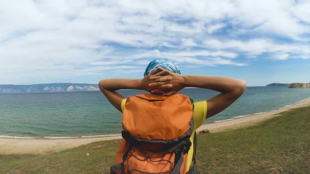 Hiking girl enjoying nature. Caucasian girl living healthy lifestyle.
