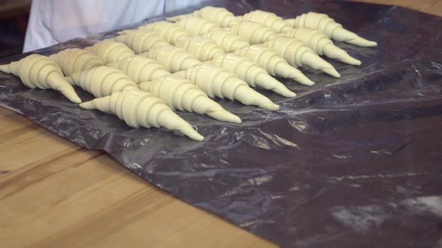 hands of the chef prepare croissants. 4k