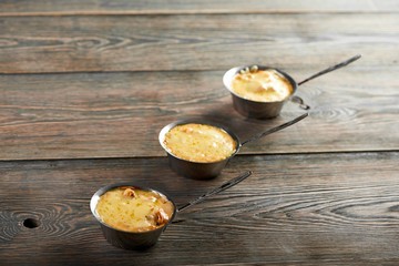 Hot appetizers julienne with mushrooms and cheese on wooden table copyspace serving appetite hunger eating restaurant menu food recipe tradition cooking cusine.