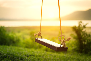 Children swing in the park (vintage tone)
