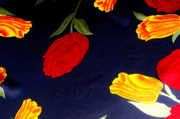 Texture, background, pattern. Cloth - silk women's handkerchief. Drawing Bright yellow red tulips on a blue background.  Temple Flowers Purple Yellow Dancing Tulips Floral fabric