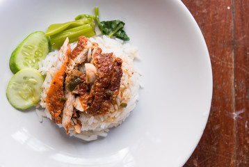 Roasted duck with rice on the wooden table