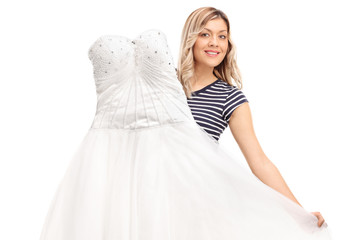 Fototapeta premium Young woman showing a weeding dress