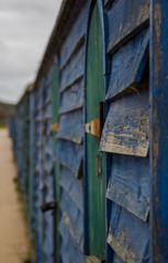 old weathered beach huts 