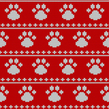 Abstract knitted dog paw seamless pattern background. Knit texture for design new year card, christmas invitation, holiday wrapping paper, winter vacation travel and ski resort advertising etc.
