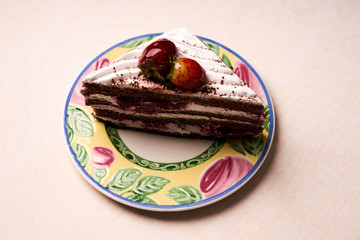 Slice of fruit Christmas cake with fresh strawberry