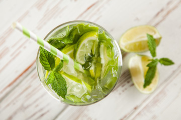 Mojito cocktail on white wood background