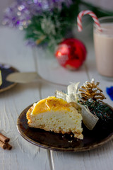 Piece of christmas cake ready to eat on rustic plate.