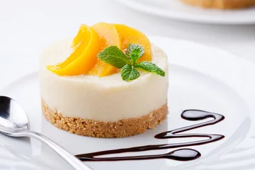Foto op Canvas Homemade Cheesecake With Poached Peaches © mpessaris
