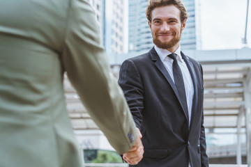 Businessman shaking hands with partner. Concept of deal successful and negotiation agreement.