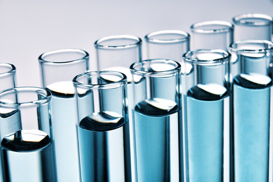 Row of full test tubes background