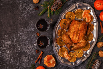 Roasted whole chicken with Christmas decoration.