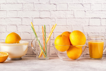 Oranges and juicer for making orange juice.