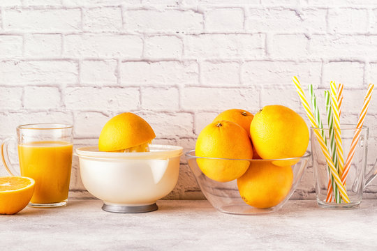 Oranges and juicer for making orange juice.
