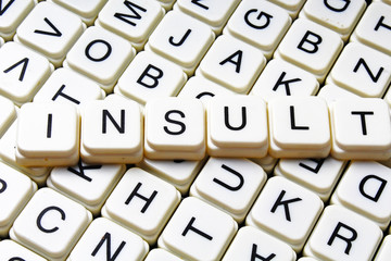 Insult text word crossword. Alphabet letter blocks game texture background texture.
