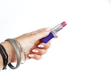Woman hand holding lipstick on isolated white cutout background. Studio photo with studio lighting easy to use for every concept.