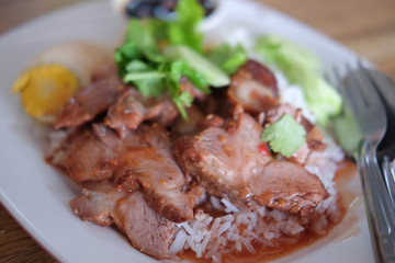 Barbecued red pork in sauce with rice