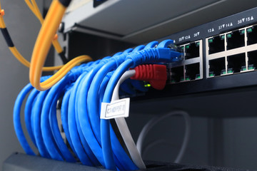 internet wires cable system in rack server switch center.