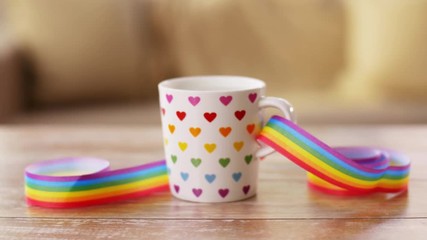 cup of hot drink with gay pride awareness ribbon