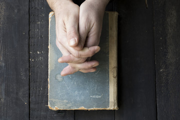 Man Praying on Table