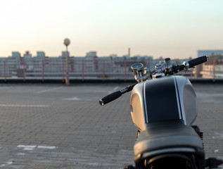 Naklejka premium Vintage custom motorcycle on parking