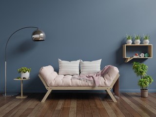 Living room with sofa on wooden flooring and dark blue wall,3d rendering