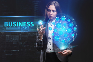 The concept of business, technology, the Internet and the network. A young entrepreneur working on a virtual screen of the future and sees the inscription: Business