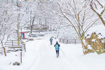  winter landscape in the mountains with falling snow and  hiker trekking photo ,South Korea.