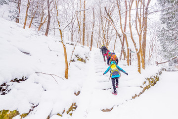  winter landscape in the mountains with falling snow and  hiker trekking photo ,South Korea.