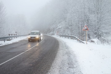 Winter weather, snow on the road. Snow calamity on the road. Snowstorm in Slovakia, mountain pass .