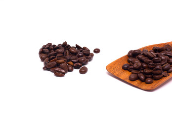 Coffee beans on a wooden spoon Is on a white background