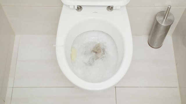 Fushing Toilet. Water drained into the toilet bowl. View from the top