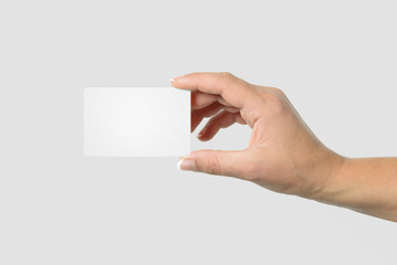 Mockup of female hand holding a Business Card isolated on light grey background. Rounded Corner.