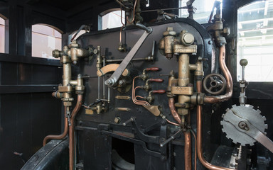 Fototapeta na wymiar Vintage locomotive - Controling an old train