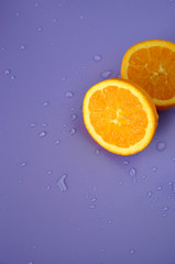 Fototapeta na wymiar Fresh Navel Orange on Purple Background