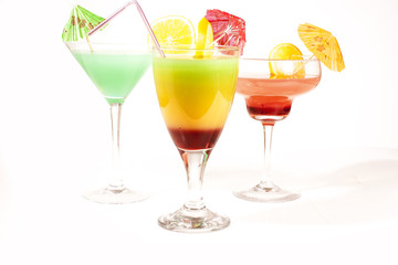 Fruit cocktail. Beautiful colorful cocktail concept. Studio photo illustration. Rainbow cocktails. Vodka martini and alcohol free cocktails. Apple martini.