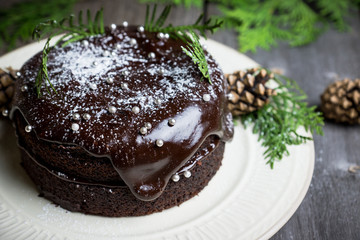 Creamy cake with chocolate glaze on the rustic background. Selective focus. Shallow depth of field.